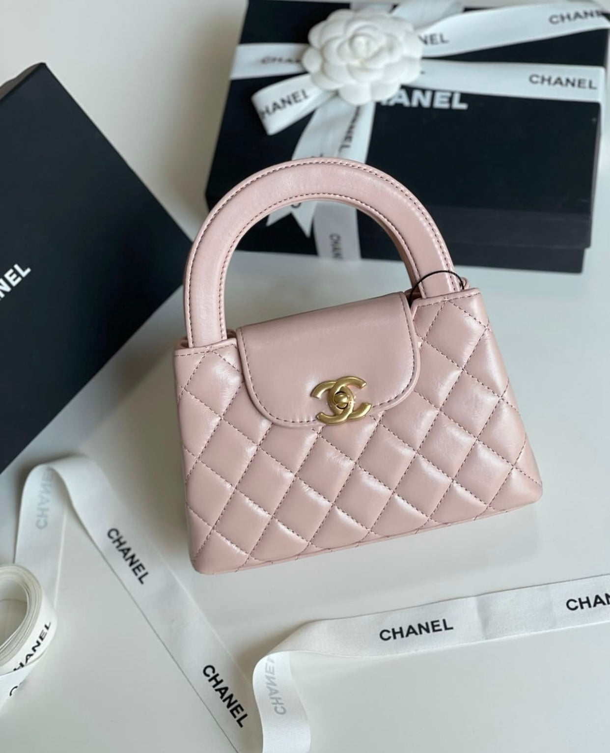 CHANEL Kelly mini handbag with brand box